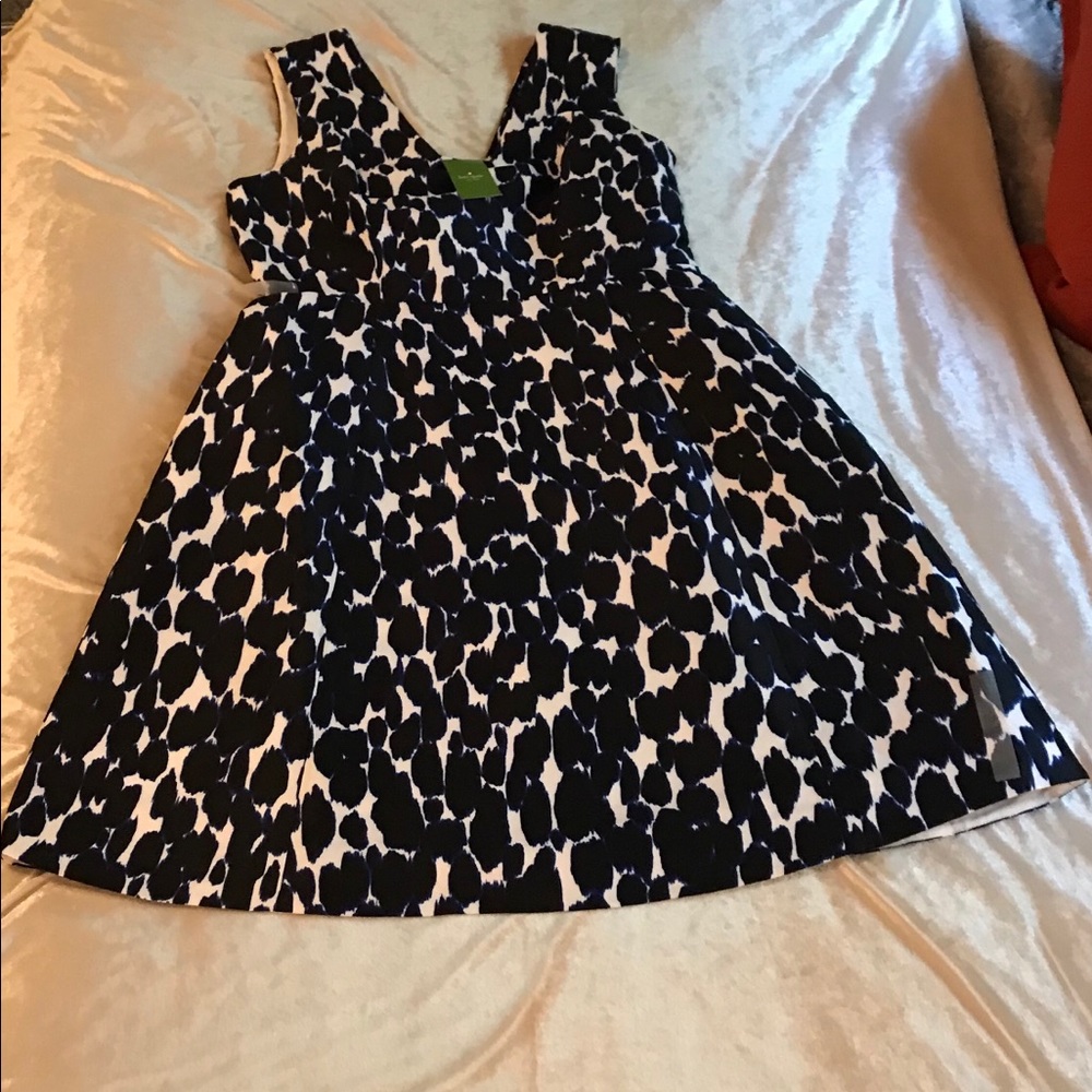 Kate Spade new dress. Enhances figure.